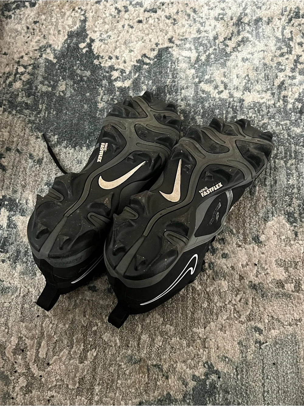 Nike Black Football Cleats with White Swoosh Accents